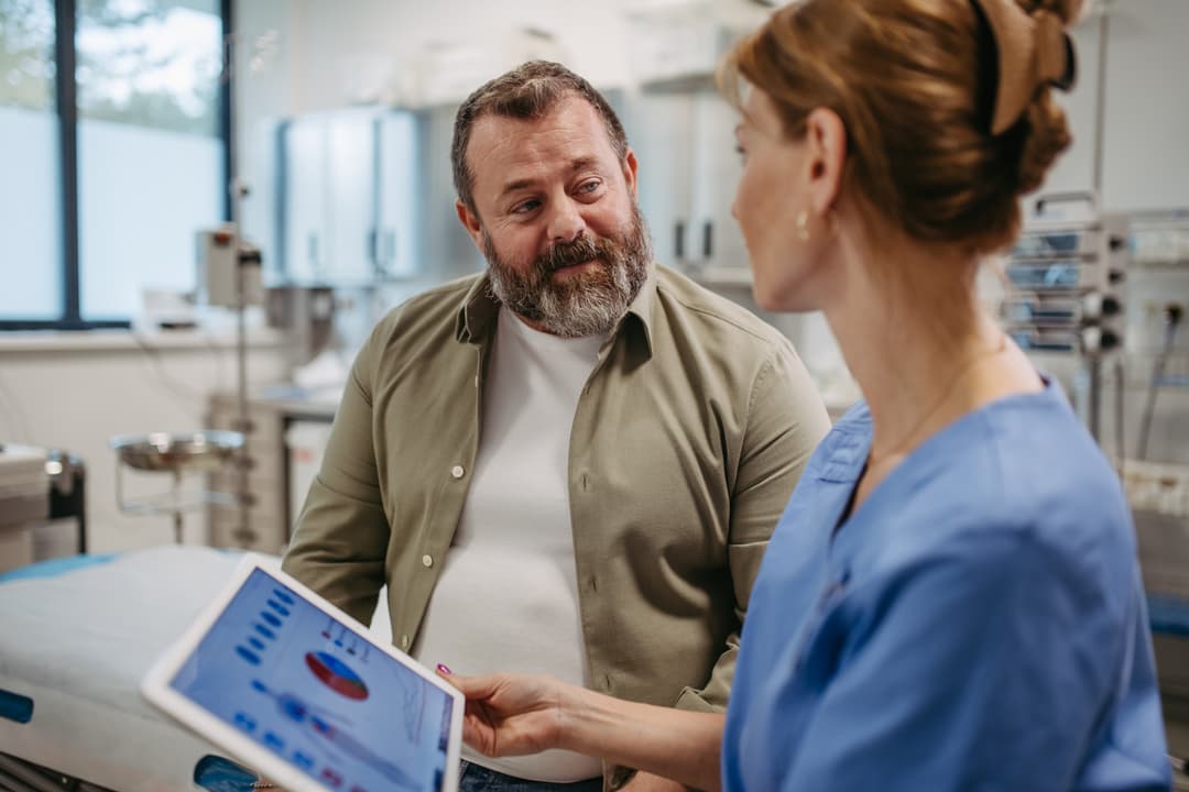 Female doctor consulting with overweight patient