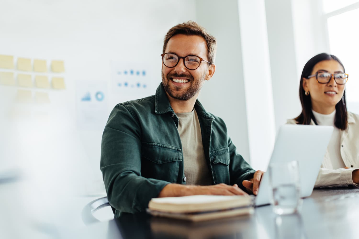 Happy business man listening to a discussion