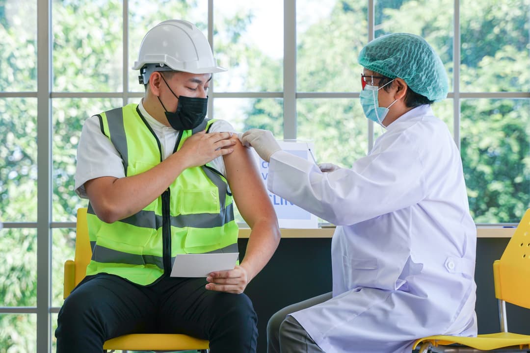 Vaccination for Essential Workers in clinic healthcare at industrial factory.