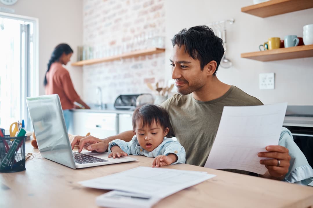 Man and baby in house or home kitchen and insurance paper