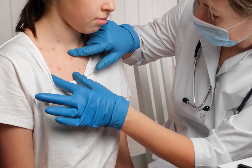 Kid with Red Rash being Examined at the Physician