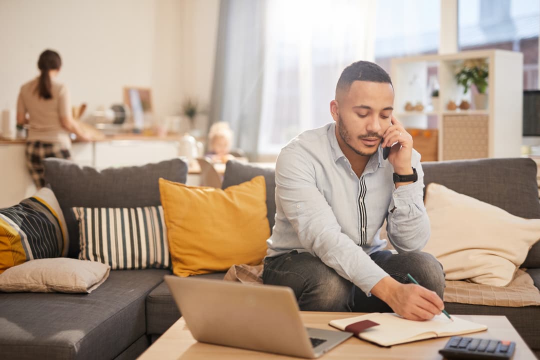 Modern Father Working from Home and choosing health insurance