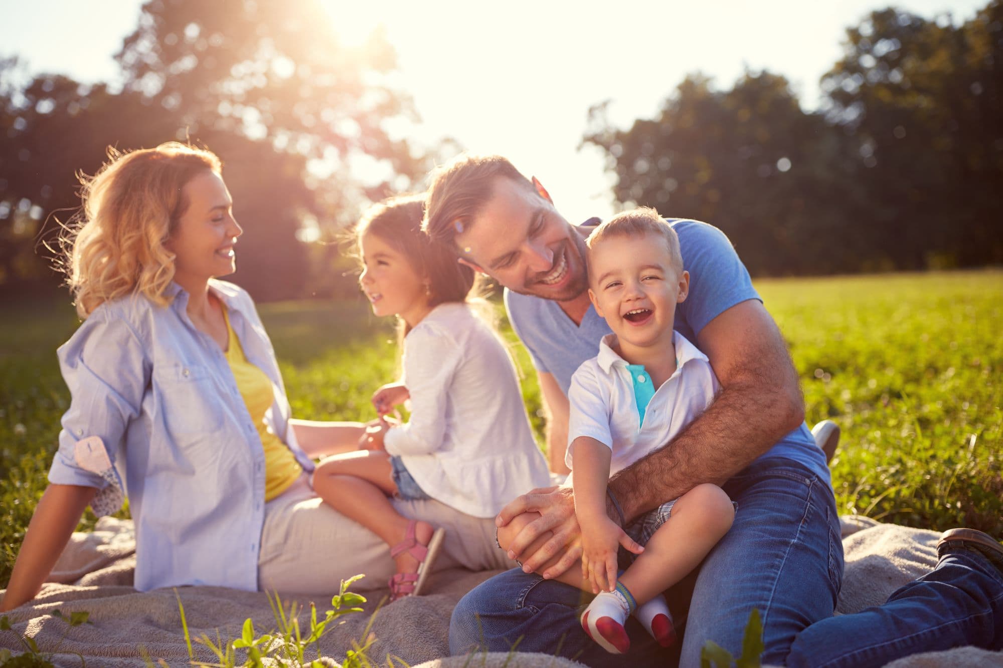 young and healthy family enjoying a picnic