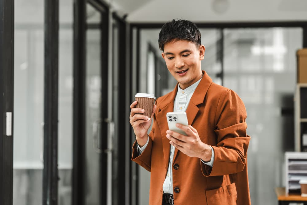 Employee using cell phone in office