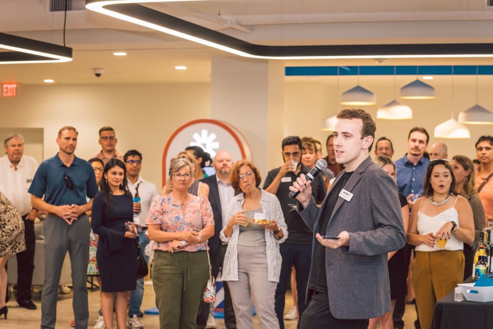 CEO, Fred Turner, speaking at austin chamber of commerce happy hour event