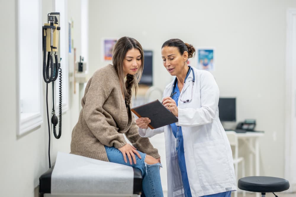 young female patient at doctors office