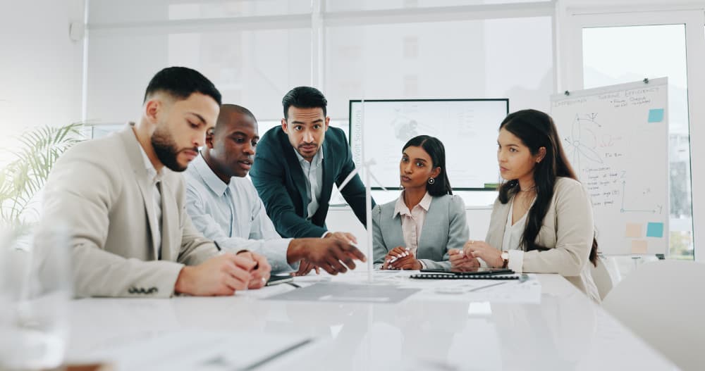 Florida employees meeting to discuss health insurance in large, sunny conference room