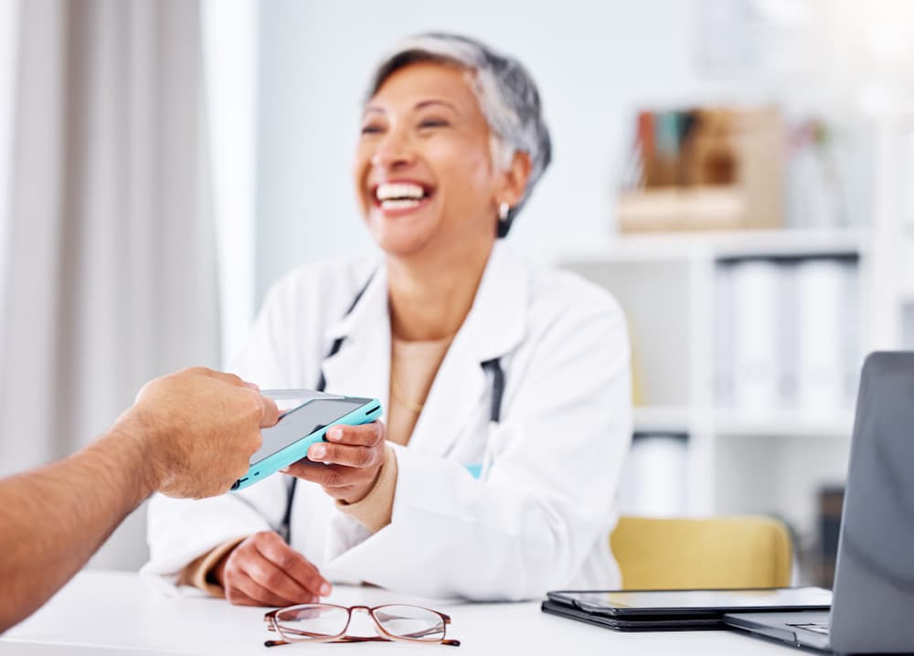 patient paying with Curative zero card in apple wallet